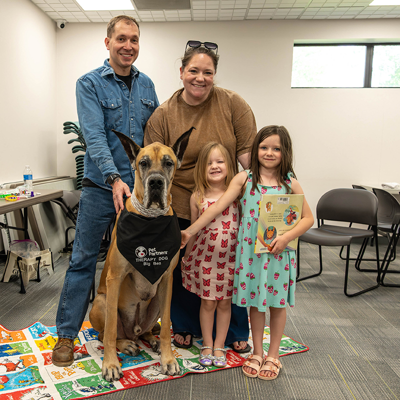 therapy dog at a children's reading event