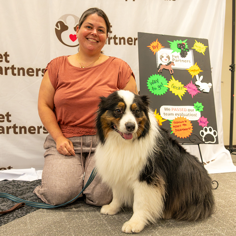 therapy dog at a children's reading event